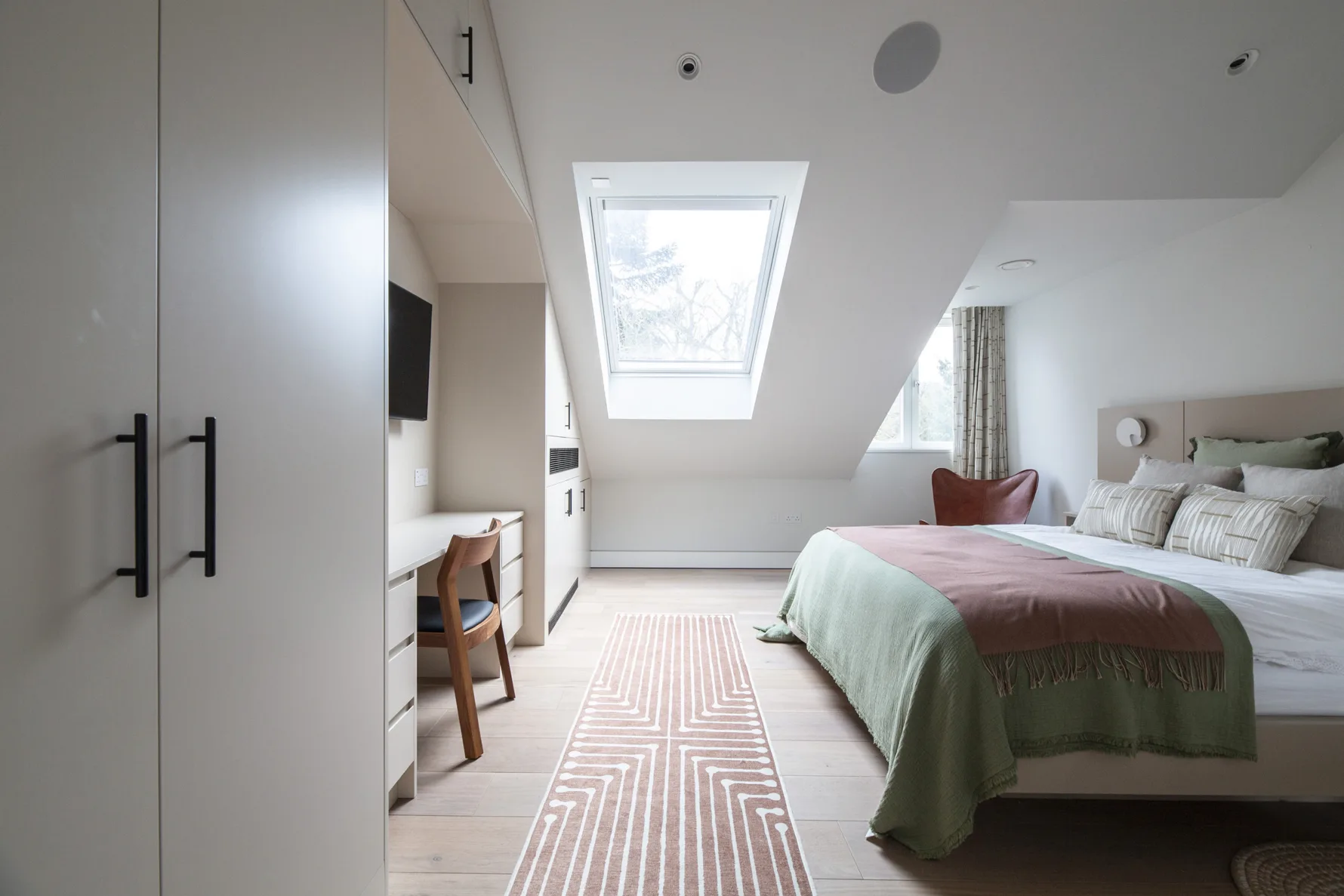 bedroom with rooflight and sloped ceiling