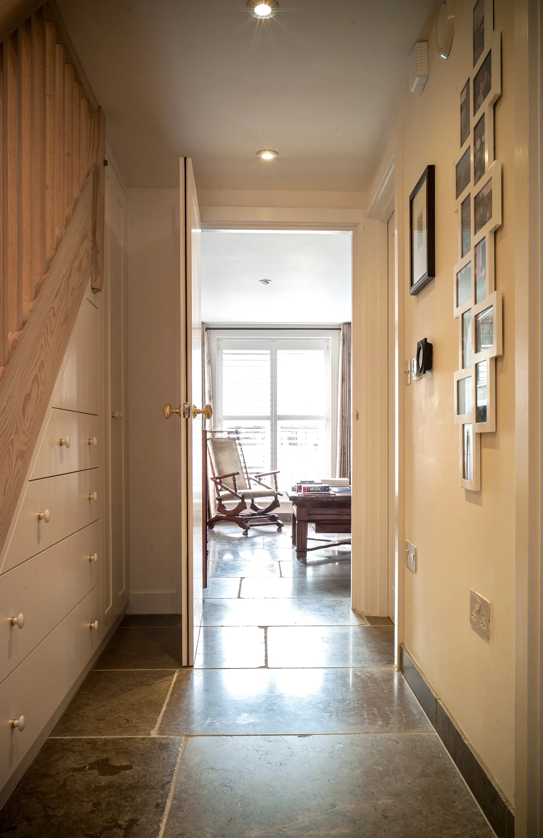 Thames Ditton House 04 showcasing bespoke under-stair joinery and carefully detailed interiors maximise storage while supporting the project's accessibility and sustainability objectives