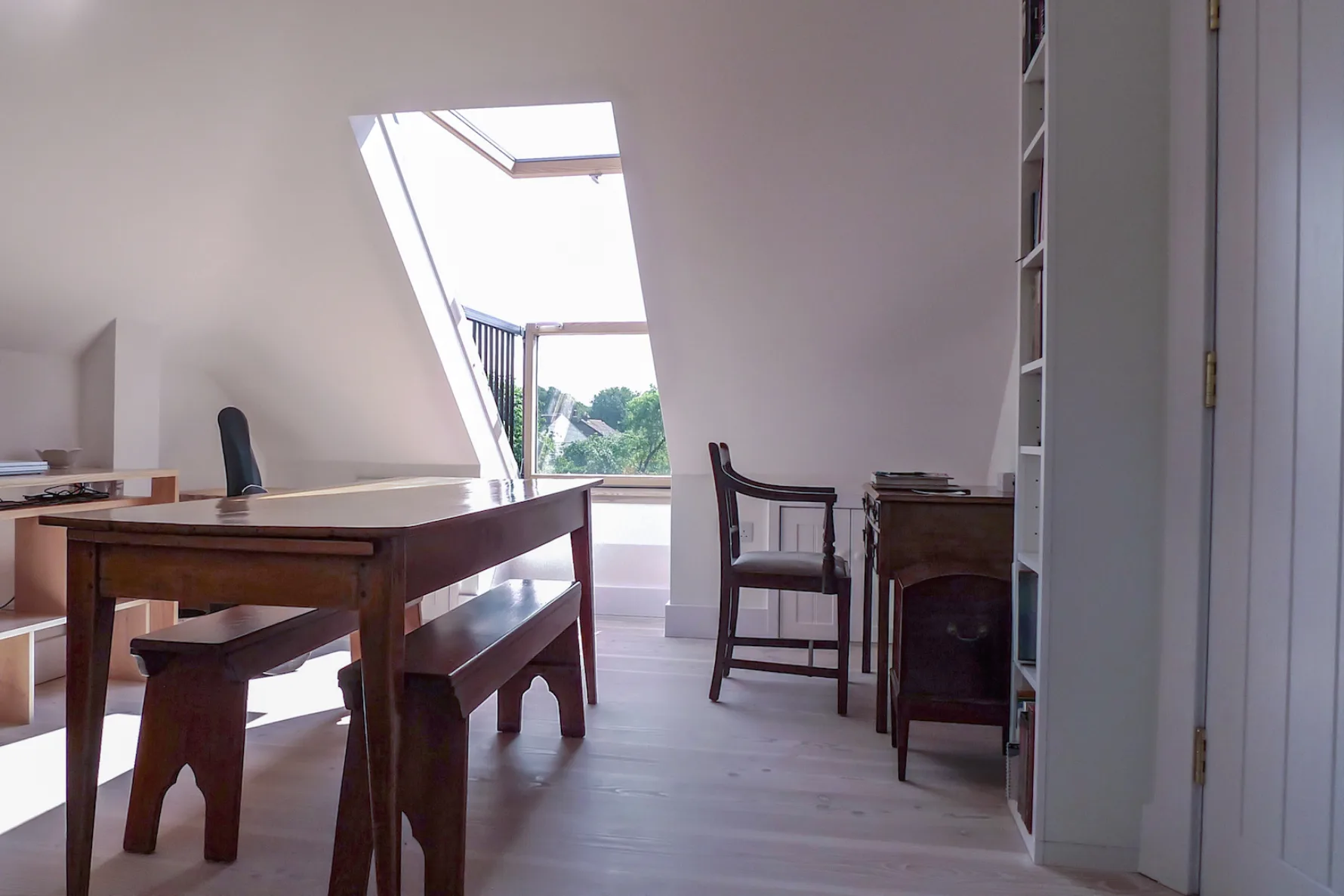 New loft conversion and home office within Thames Ditton House 04, bringing natural light into the extended roof space