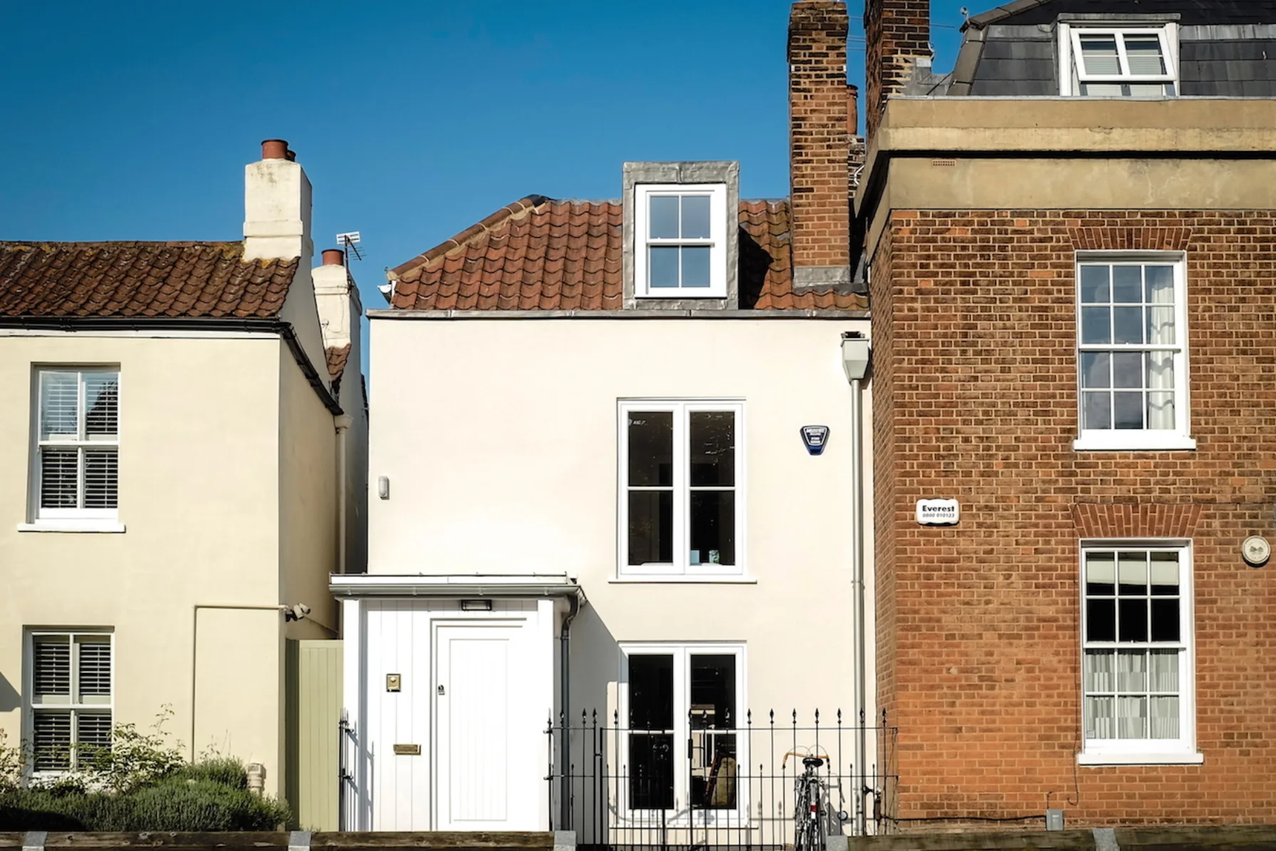 Restored front elevation of Thames Ditton House 04, a remodelled and extended historic cottage within the Weston Green Conservation Area.