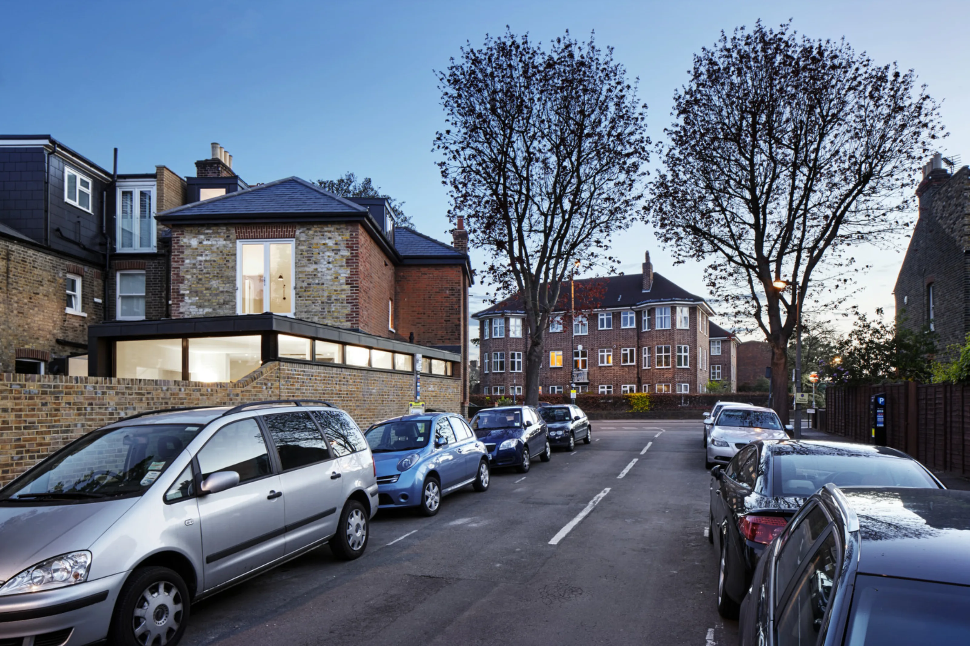 Street view of Twickenham House showing the contemporary rear extension integrated with the original Victorian property.