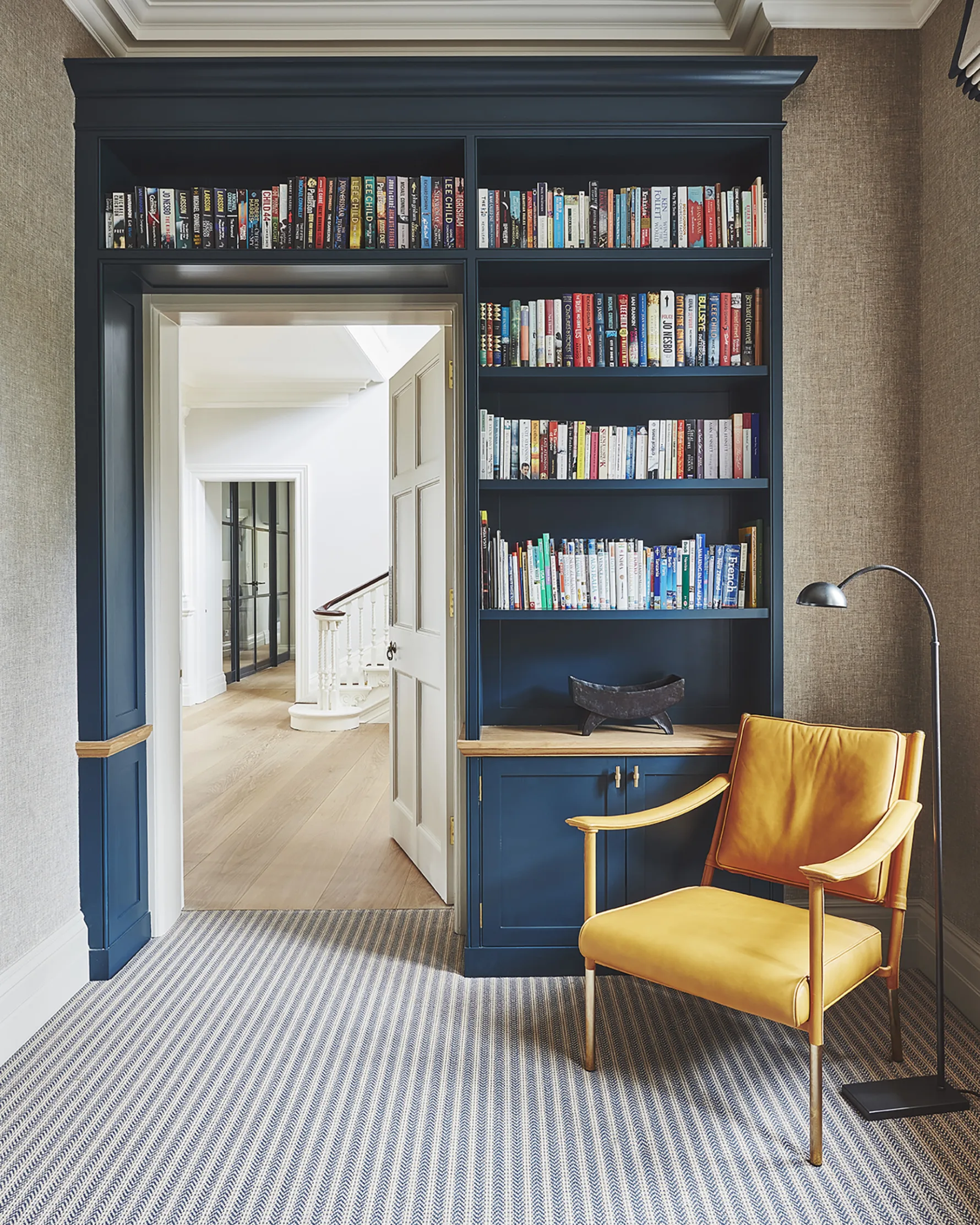 Bespoke fitted bookcase and reading area within the renovated interiors of Westerham House.