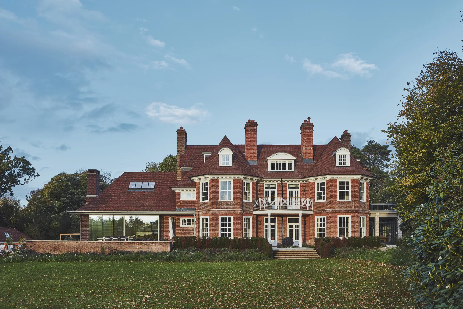 Rear elevation of Westerham House showing the restored Edwardian façade and contemporary brick and glazed extensions.